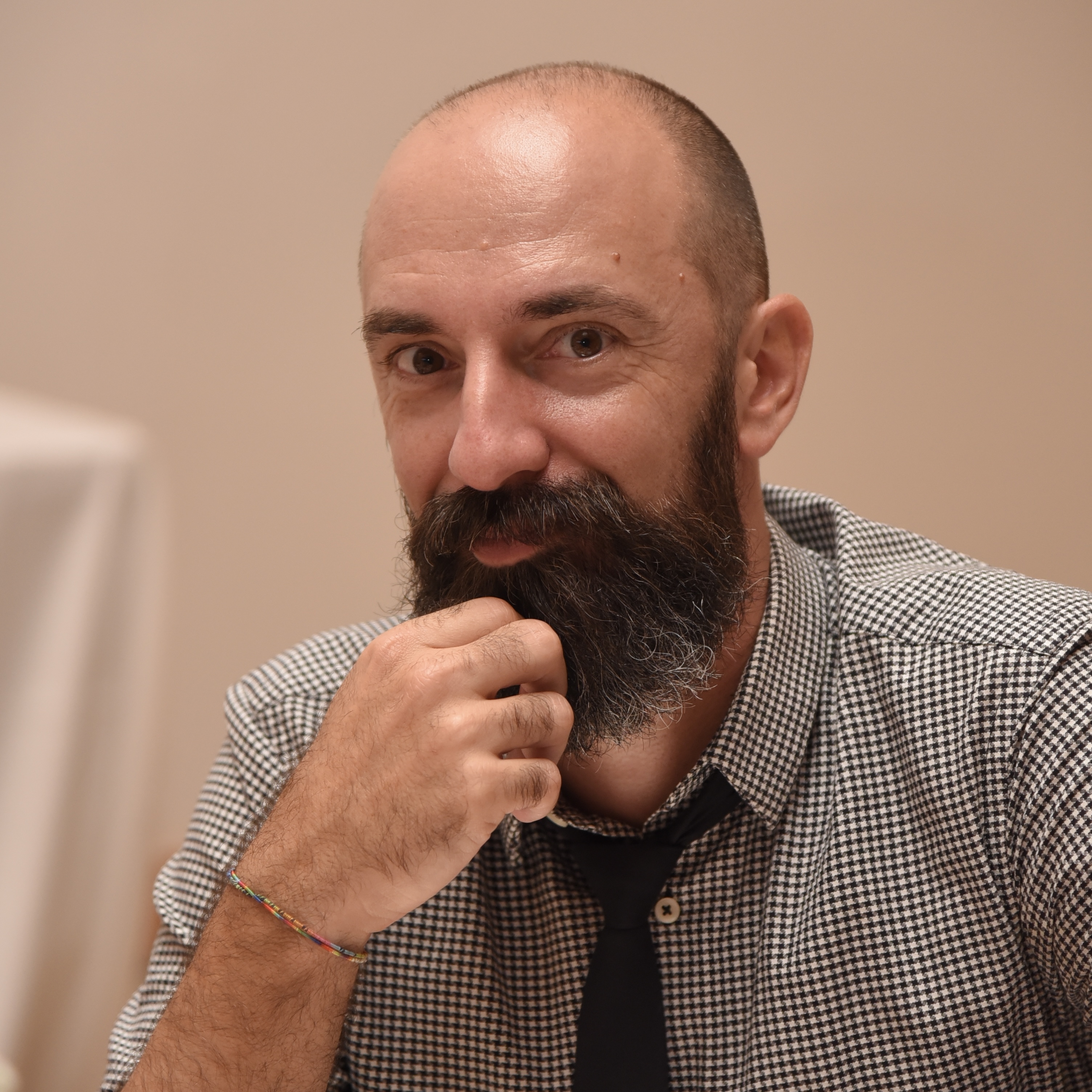 Bruno Santos Amaro, smiling, hand on his beard